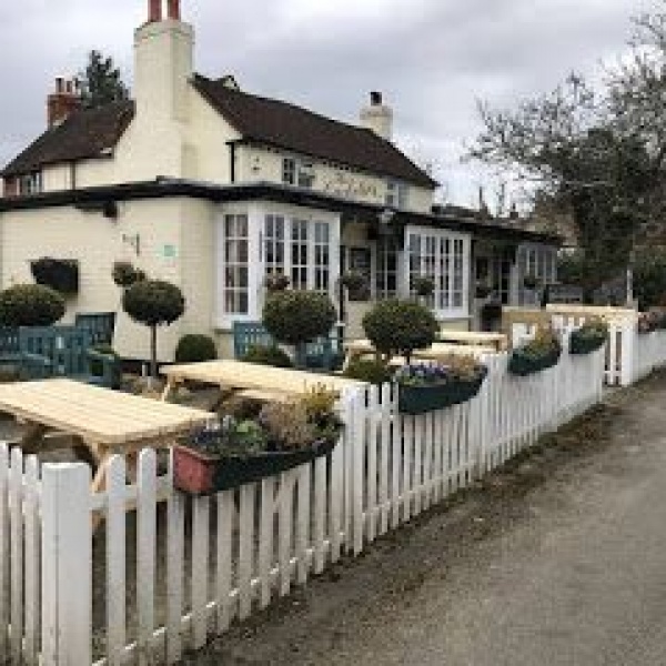 six pub benches in a beer garden