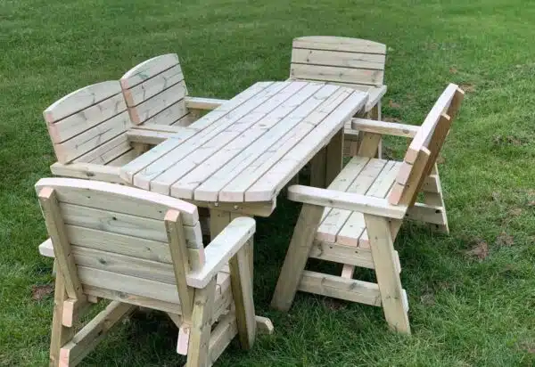 side view of a six seater outdoor dining set with one wooden bench and four single wooden chairs