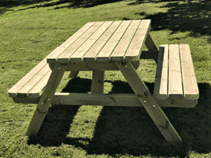 wooden picnic table in the sunshine
