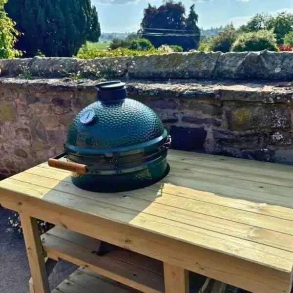 Custom BBQ table with cut-out holding Big Green Egg BBQ