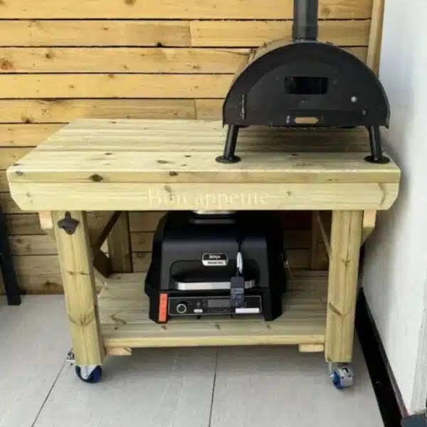 Wooden workbench with wheels storing BBQs