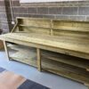 Large indoor wooden workbench with backboard