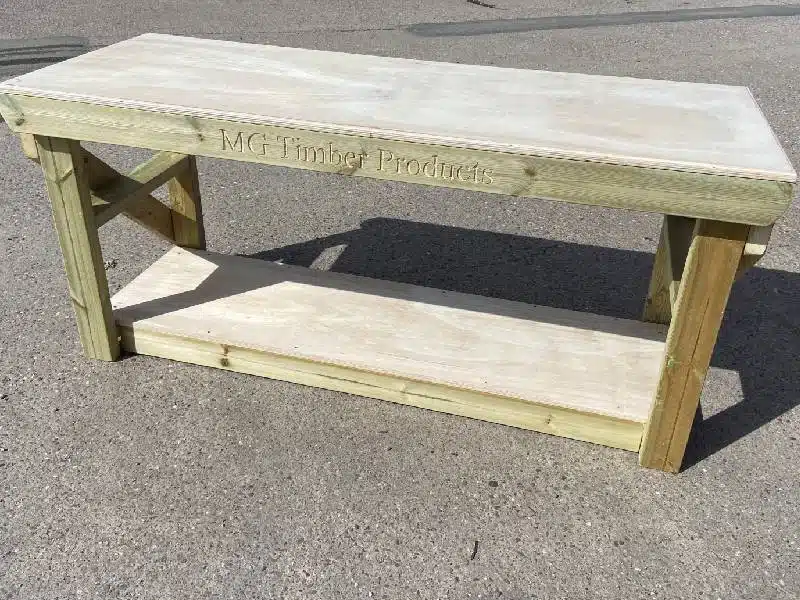 a frame wooden picnic table at a public farm