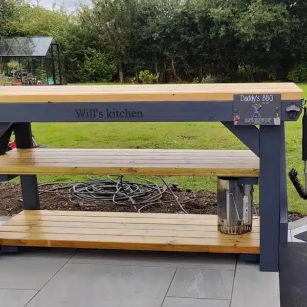 Custom grey painted workbench with personalised 'Daddy's BBQ' engraving