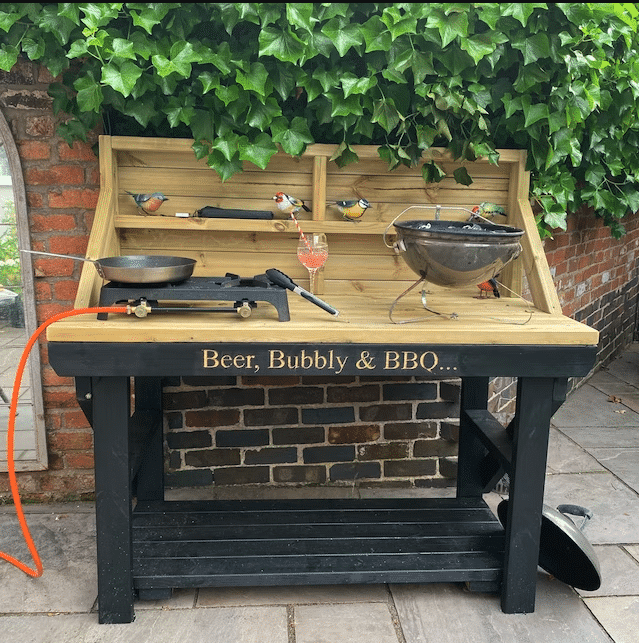 Custom outdoor wooden workbench with backboard. Black painting and personalised engraving.