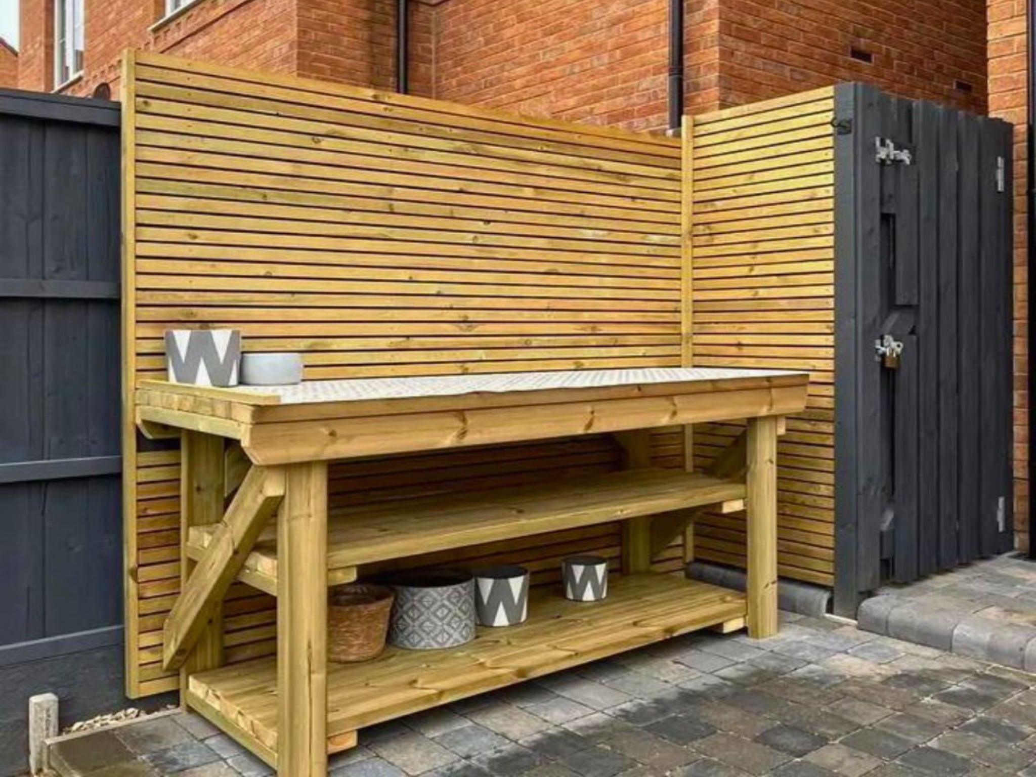 a frame wooden picnic table at a public farm