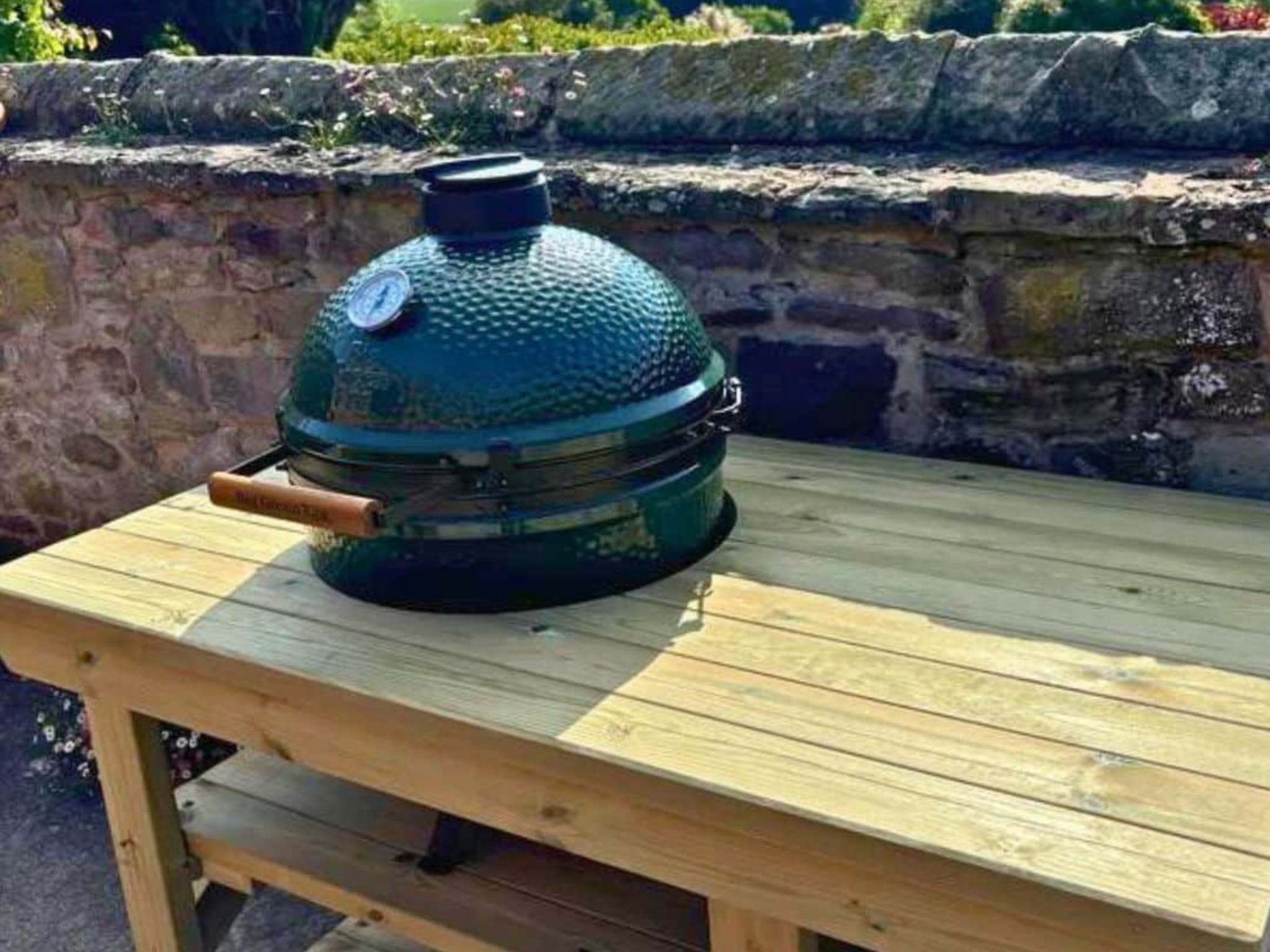 Custom BBQ table with cut-out holding Big Green Egg BBQ