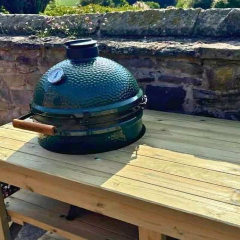 wooden bbq bench with a metal bbq on top